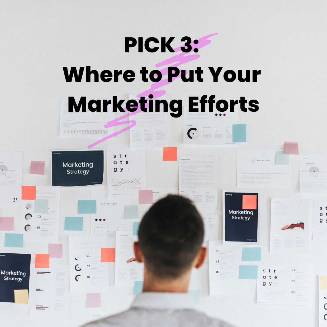 A man looking at a wall of Post It notes that say Marketing Strategy